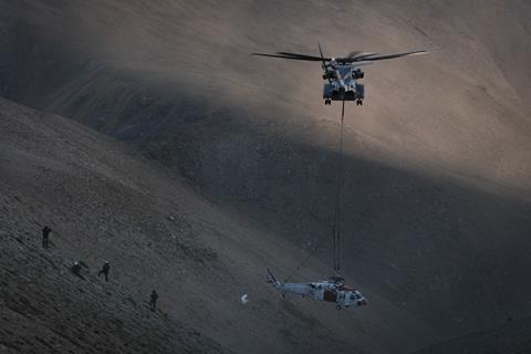 CH-53K King Stallion lifts a Navy MH-60S Knighthawk Helicopter from a draw in Mount Hogue c USMC